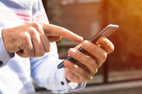 Premium Photo Man Holding Smart Phone