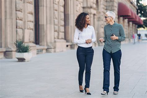 Two People Walking Pictures Download Free Images On Unsplash