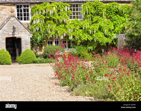 Traditional English Cottage Courtyard With Gravel Driveway Stone Stock