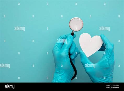 Heart Health Check Up Doctor With Stethoscope And Heart Shape Stock