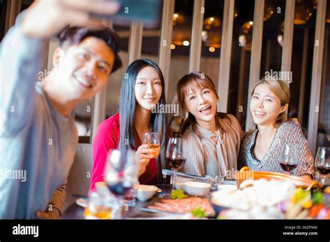 Happy Friends Taking Selfie In Hot Pot Restaurant Stock Photo Alamy