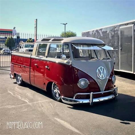 An Old Vw Bus Parked In A Parking Lot