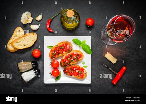 Italian Cuisine Bruschetta Antipasto With Glass Of Rose Wine Olive Oil