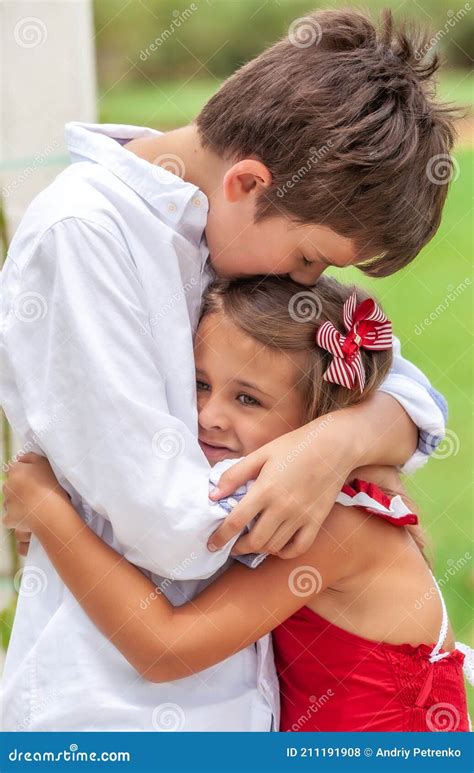 Emotional Brother Hugging Sister In The Park Outdoors Stock Photography