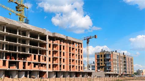 New Multi Storey Residential Buildings Under Construction And Cranes