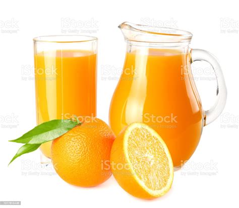 Orange Juice With Orange Slices And Green Leaf Isolated On White Background Juice In Jug Stock