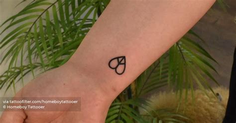 Heart Shaped Peace Symbol Tattoo On The Wrist