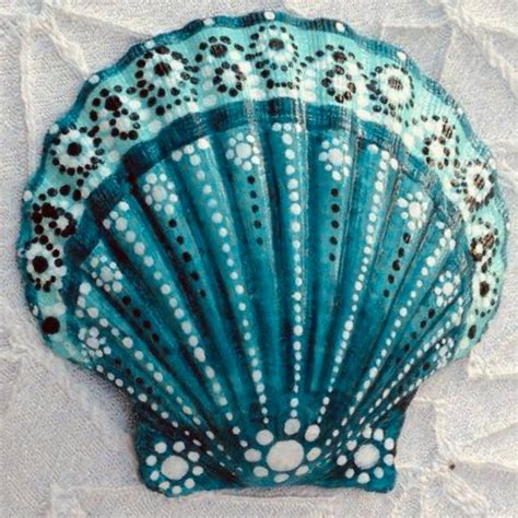 A Close Up Of A Blue Fan On A White Surface With Polka Dots And Circles