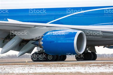 Close Up Of Airplane Engine Main Landing Gear And Part Of Wing Stock