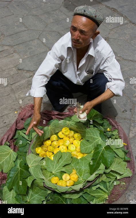 Uyghur Man Selling Figs In Kashgar In Xinjiang Province China Stock