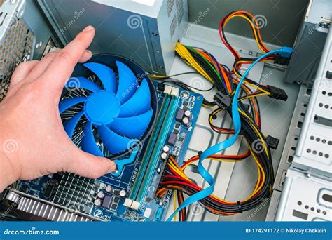 Installing a Processor Fan on the Computer Motherboard. Computer Repair ...