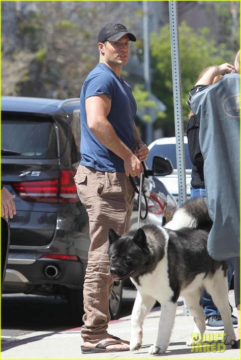 Henry Cavill Shows Off Buff Biceps Taking His Dog For A Walk Photo