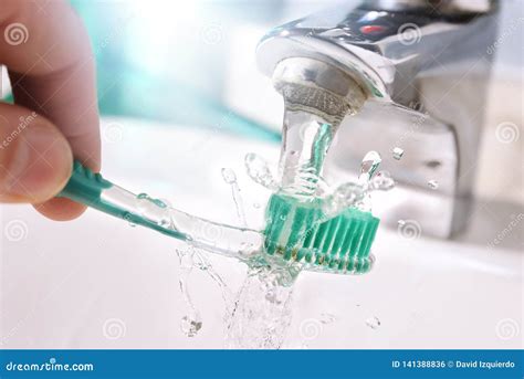 Daily Cleaning Of The Toothbrush After Use In Sink Detail Stock Photo