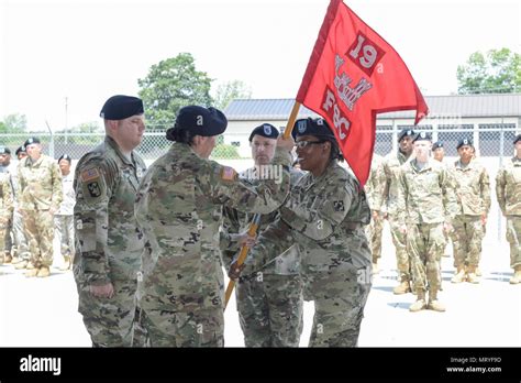 Outgoing Commander CPT Jennifer Williams Hands The Guidon To LTC Esther