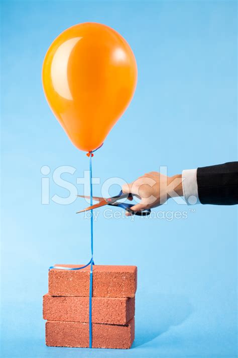 Balloon Tethered To Three Red Bricks, Scissors Cutting String Stock Photo | Royalty-Free ...