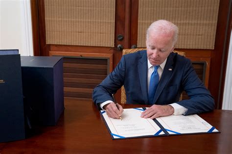 Biden Signs 1 7t Spending Bill While Vacationing In St Croix