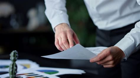 Premium Photo Unrecognizable Businessman Pointing In Document Indoors