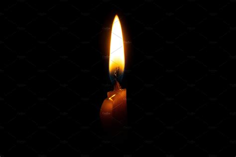 Burning Candle On Black Background Featuring Candle Flame And Black