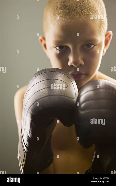 Boy wearing boxing gloves Stock Photo - Alamy