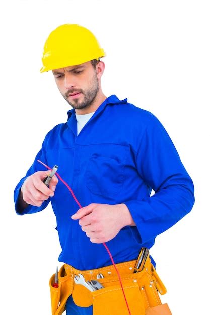 Premium Photo | Electrician cutting wire with pliers