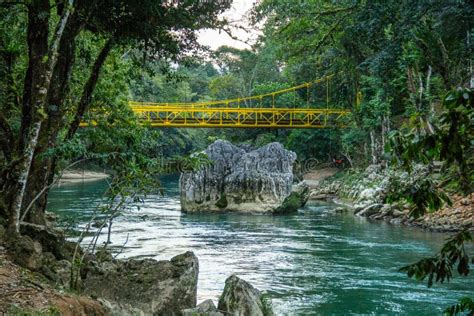 Yellow Bridge Over a Lovely River in Semuc Champey, Guatemala Stock ...