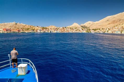 Premium Photo Boat Travel To Picturesque Halki Island In Greece