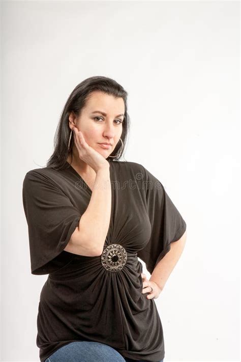 40 Something Brunette Woman In The Studio With A White Background Stock