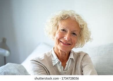 Close Portrait Smiling Older Woman Relaxing Stock Photo 1734728030