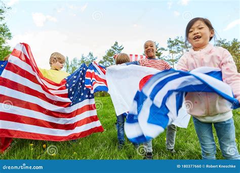 Children With Flags In The International Kindergarten Stock Photo