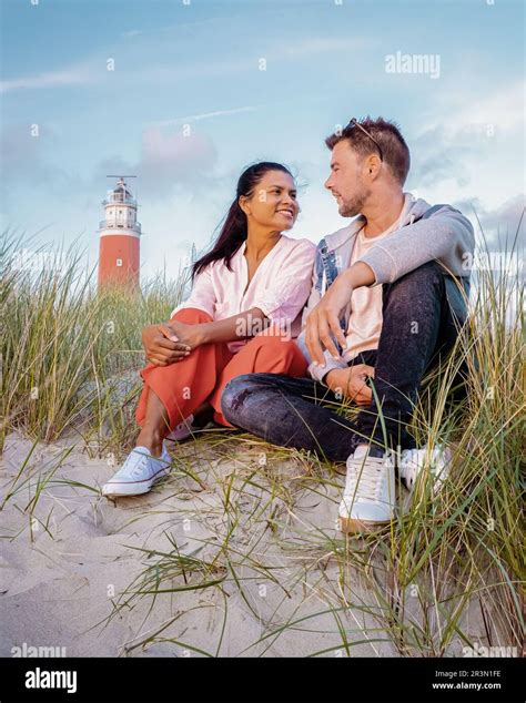 Texel lighthouse Netherlands Dutch Island Texel, couple visit the lighthouse on vacation Texel ...