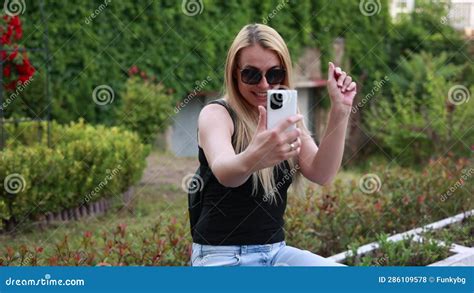 Blonde Woman Taking Selfies In The Park Video Stock Footage Video Of Outfit Woman 286109578