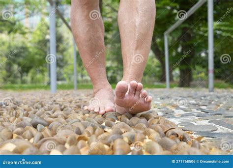 Barefoot Old Man Stepping On Stones Foot Reflexology At The Park Stock