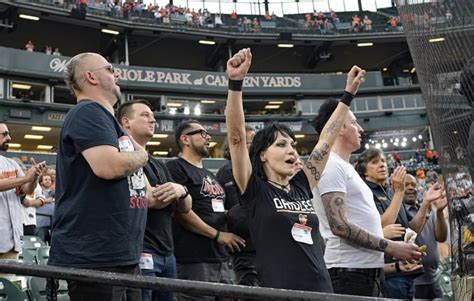 Joan Jett, Baltimore Orioles Superfan, Helps Announce Game, Photobombs Team Picture