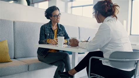 Female Employee Stretches Hands After Completing Task Stock Footage