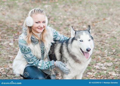 Young Woman Hugging Her Dog Husky Stock Photo Image Of Person Animal