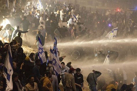 Physicians Urge Police To Suspend Water Cannon Use After Protesters