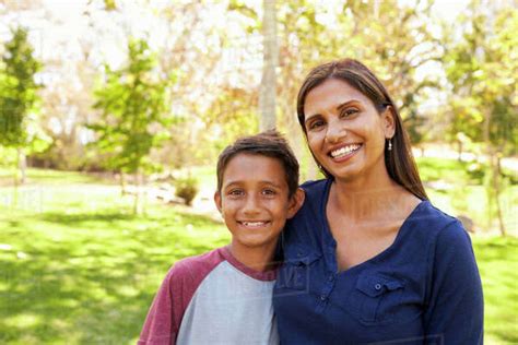 Mixed Race Asian Caucasian Mother And Son In Park Portrait Stock