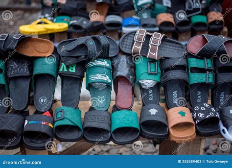 Various Brands Of Slippers And Foot Slides Editorial Stock Photo