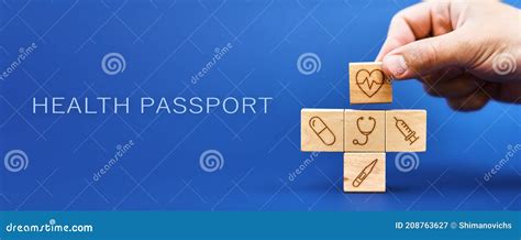 Health Passport Concept Medical Symbols On Wooden Blocks Royalty Free