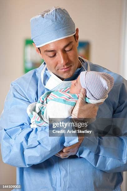 Pregnant Man Giving Birth To A Baby In Hospital Photos And Premium High