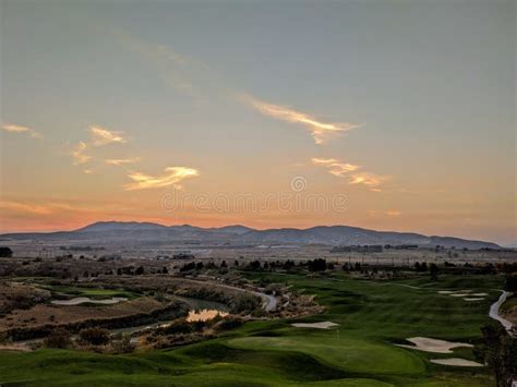 Sunset over golf course stock photo. Image of golf, mountains - 198674690