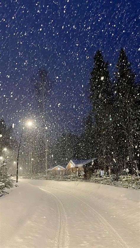 Winter Wonderland: A Snowy Road at Night