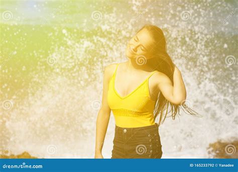 Young Dark Haired Beautiful European Girl In Yellow Swimsuit Stock