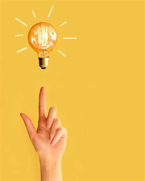 Premium Photo Creative Light Bulb With Hand