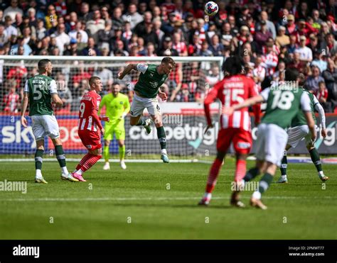 Dan Scarr 6 Of Plymouth Argyle Heads The Ball Away To Safety During