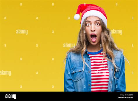 Beautiful Young Blonde Woman Wearing Christmas Hat Over Isolated