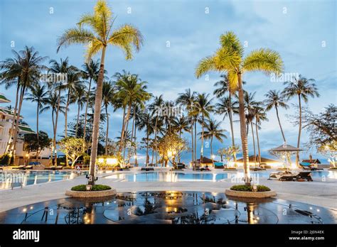 Palm Trees And Swimming Pool Of Luxury Resort In Asia Stock Photo Alamy