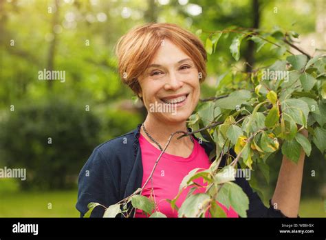 Healthy Mature Woman Having Fun With Green Leaves Outdoor Beautiful