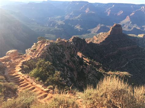 the sun shines brightly on some mountains