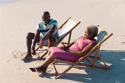 High Angle View Of Happy African American Senior Couple Sitting On